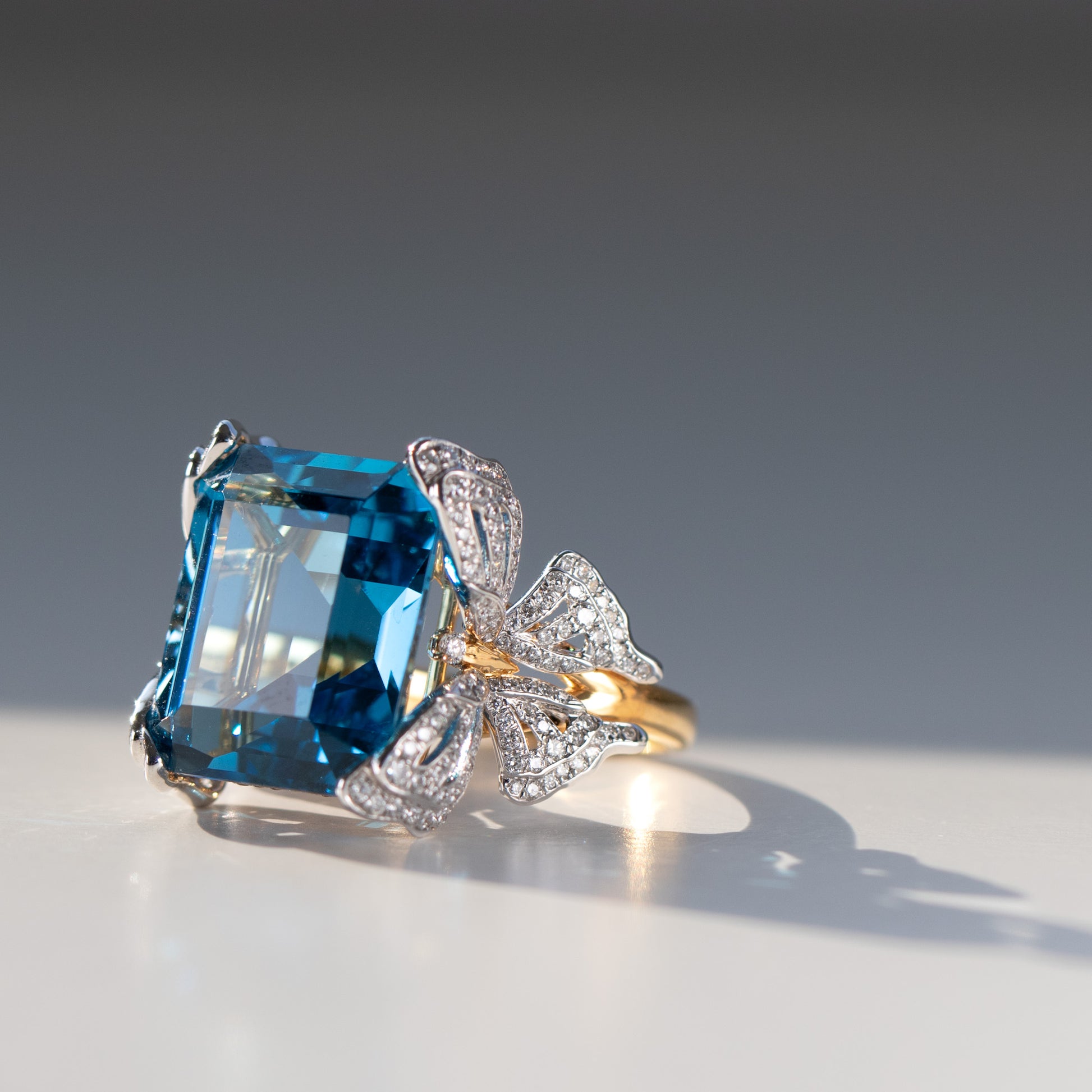 15 carat blue topaz and intricate diamond butterfly ring in 18k gold and platinum by Valentina Fine Jewellery Hong Kong. Global free shipping including USA, UK, Dubai, Qatar and Australia.