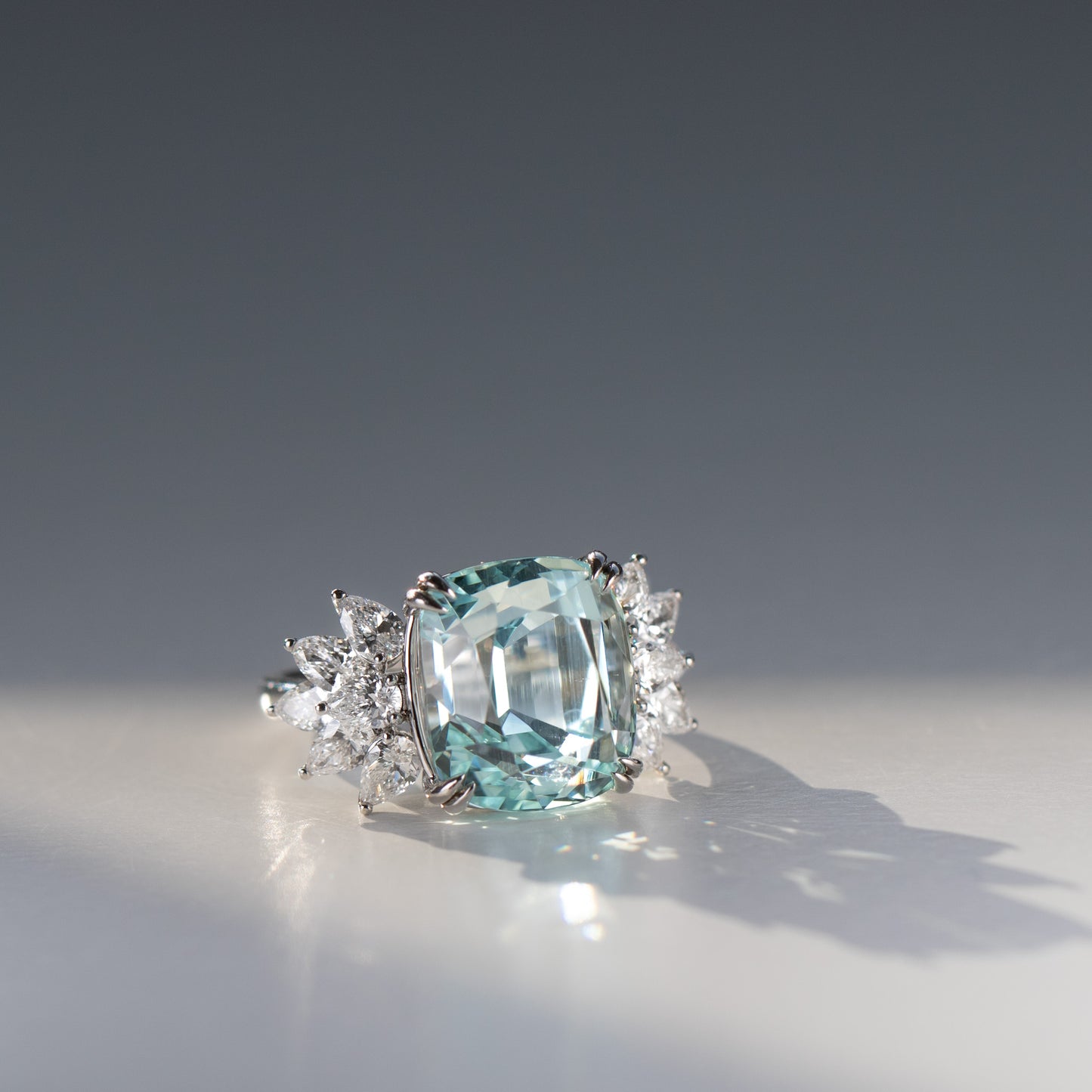 Cushion cut aquamarine and diamond ring with pear cut diamonds in 18k gold by Valentina Fine Jewellery Hong Kong. Global free shipping including USA, Dubai, Singapore, Australia and UK