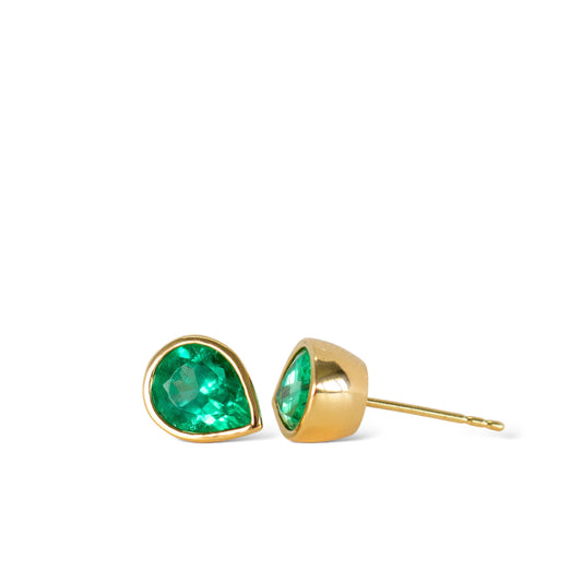 Colombian emerald bezel set green emerald stud earrings in 18k yellow gold by Valentina Fine Jewellery. Global free shipping including USA.