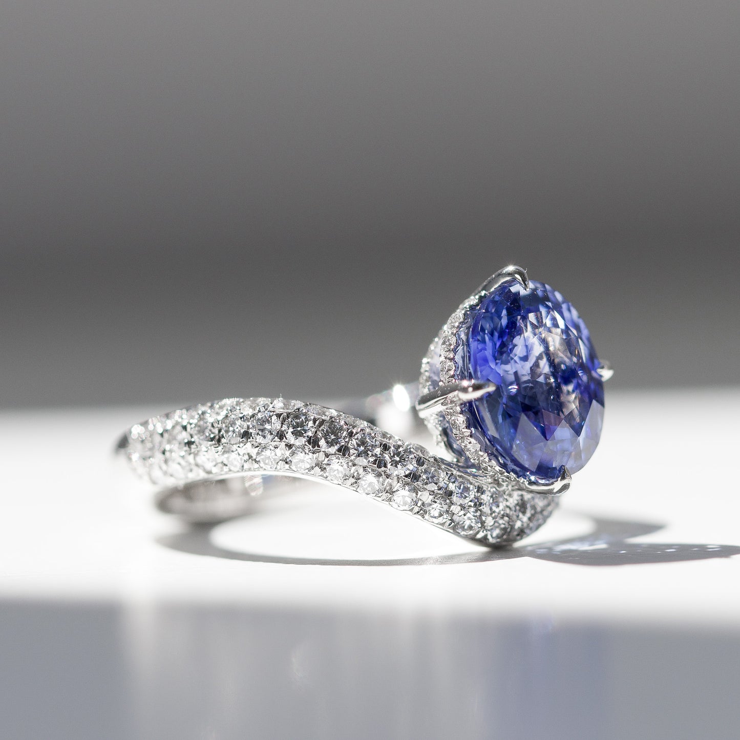 No Heat Blue Oval Sapphire and diamond curve ring in platinum by Valentina Fine Jewellery HK. Cornflower blue natural sapphire. Global free shipping including USA