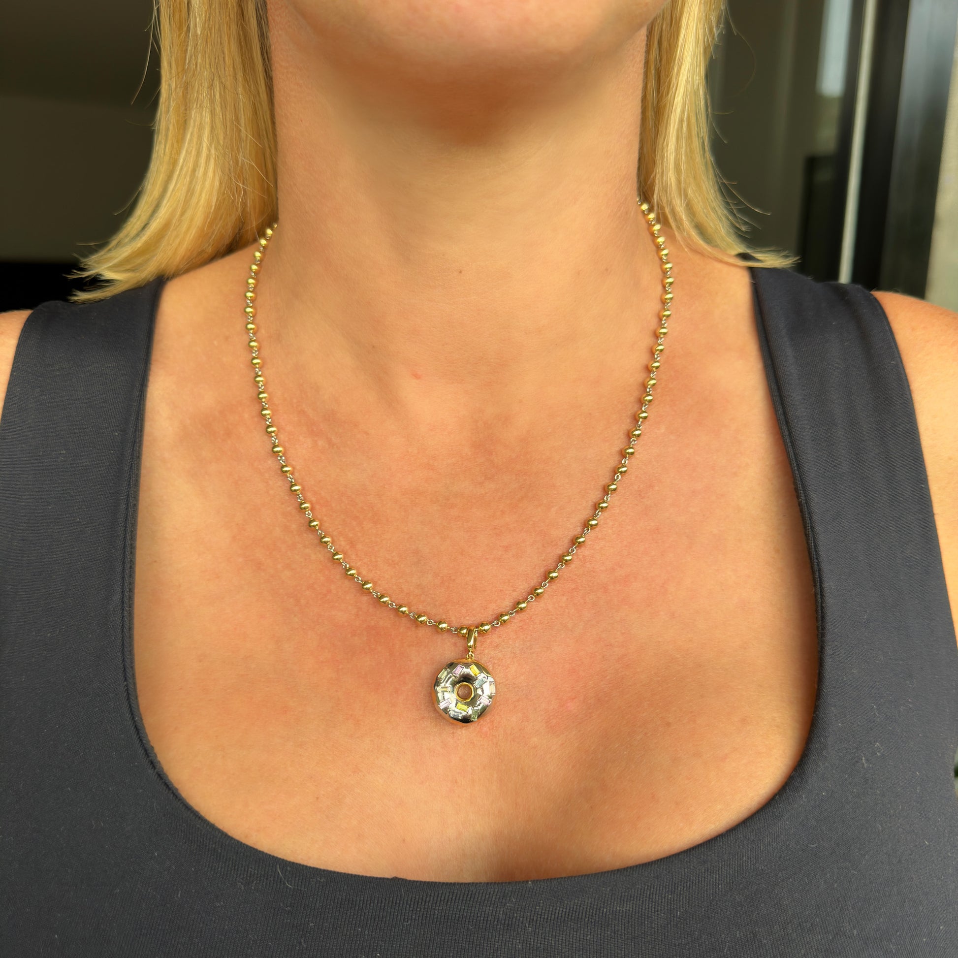 Gold and platinum doughnut aka donut pendant charm with no heat natural sapphires by Valentina Fine Jewellery. Global free shipping including UK, USA and Australia. Shown with our gold ball chain necklace.