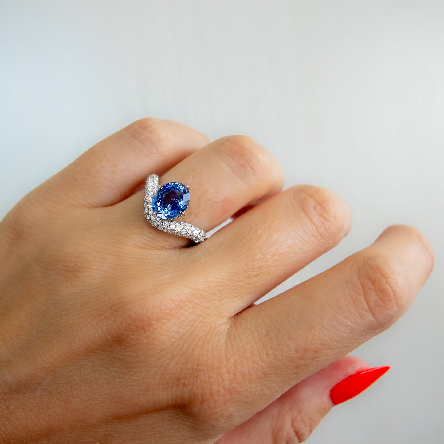 No Heat Blue Oval Sapphire and diamond curve ring in platinum by Valentina Fine Jewellery HK. Global free shipping inclduing USA