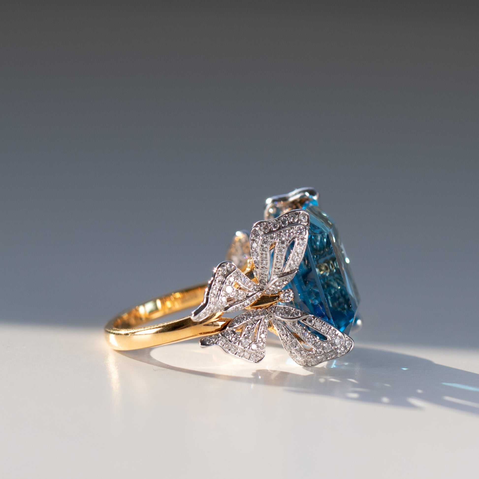 15 carat blue topaz and diamond butterfly ring in 18k gold and platinum by Valentina Fine Jewellery Hong Kong. Global free shipping including USA, UK, Dubai, Qatar and Australia.