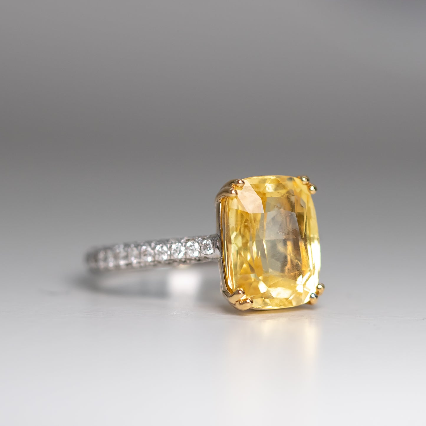 6.77 carat no heat elongated cushion yellow sapphire and diamond ring in 18k gold by Valentina Fine Jewellery Hong Kong. Global free shipping including USA, Australia, Canada, Singapore and Dubai