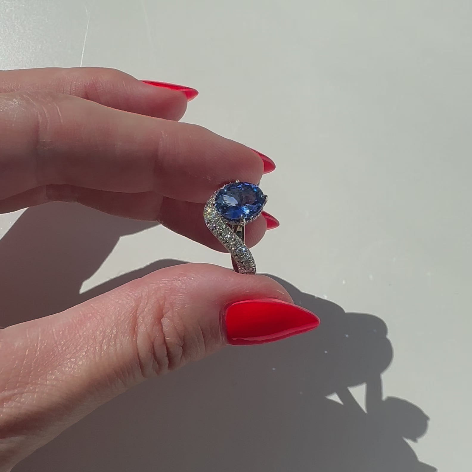 No Heat Cornflower Blue Oval Sapphire and diamond curve ring in platinum by Valentina Fine Jewellery HK. Global free shipping including USA